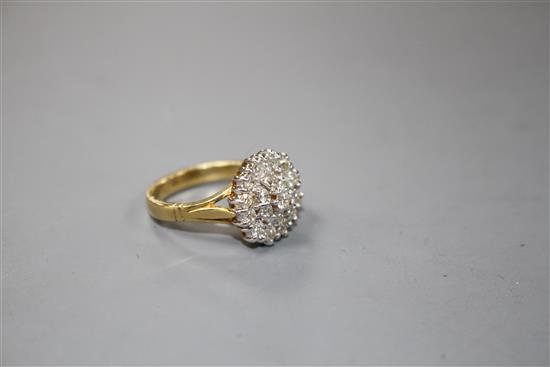 A modern 18ct gold and diamond cluster dress ring,